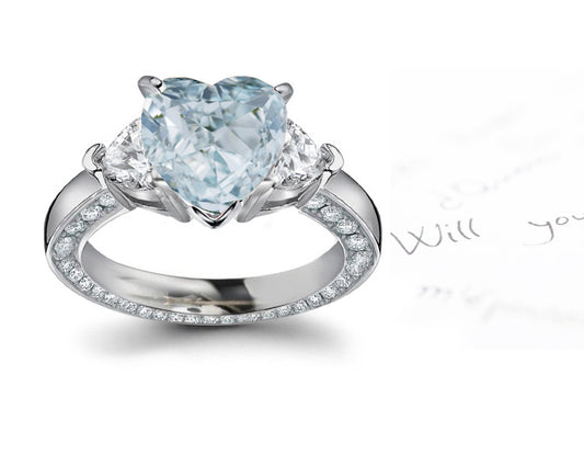 engagement ring three stone with fancy heart blue diamond center and heart white diamond sides