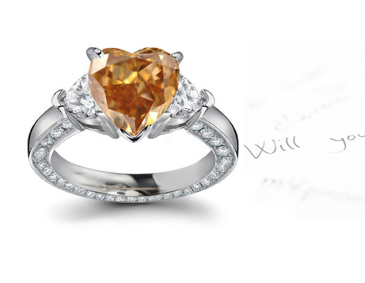 engagement ring three stone with fancy heart brown diamond center and heart white diamond sides