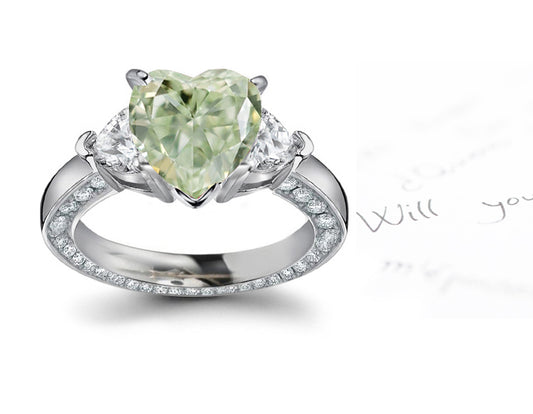 engagement ring three stone with fancy heart green diamond center and heart white diamond sides