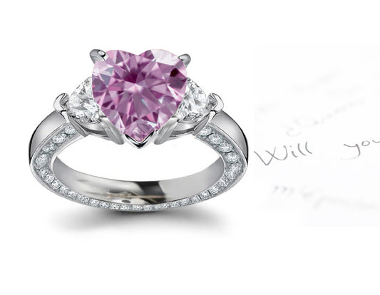 engagement ring three stone with fancy heart pink diamond center and heart white diamond sides