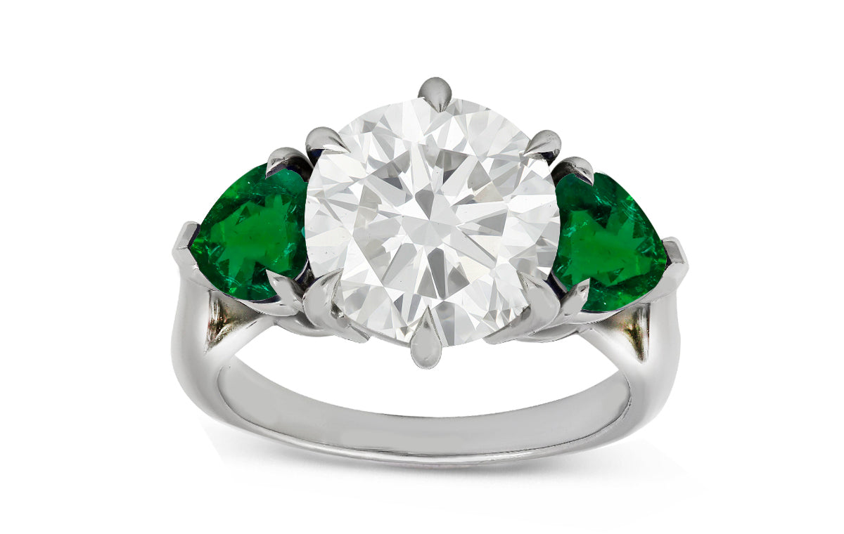 78 custom made unique round diamond and heart emerald side three stone engagement ring