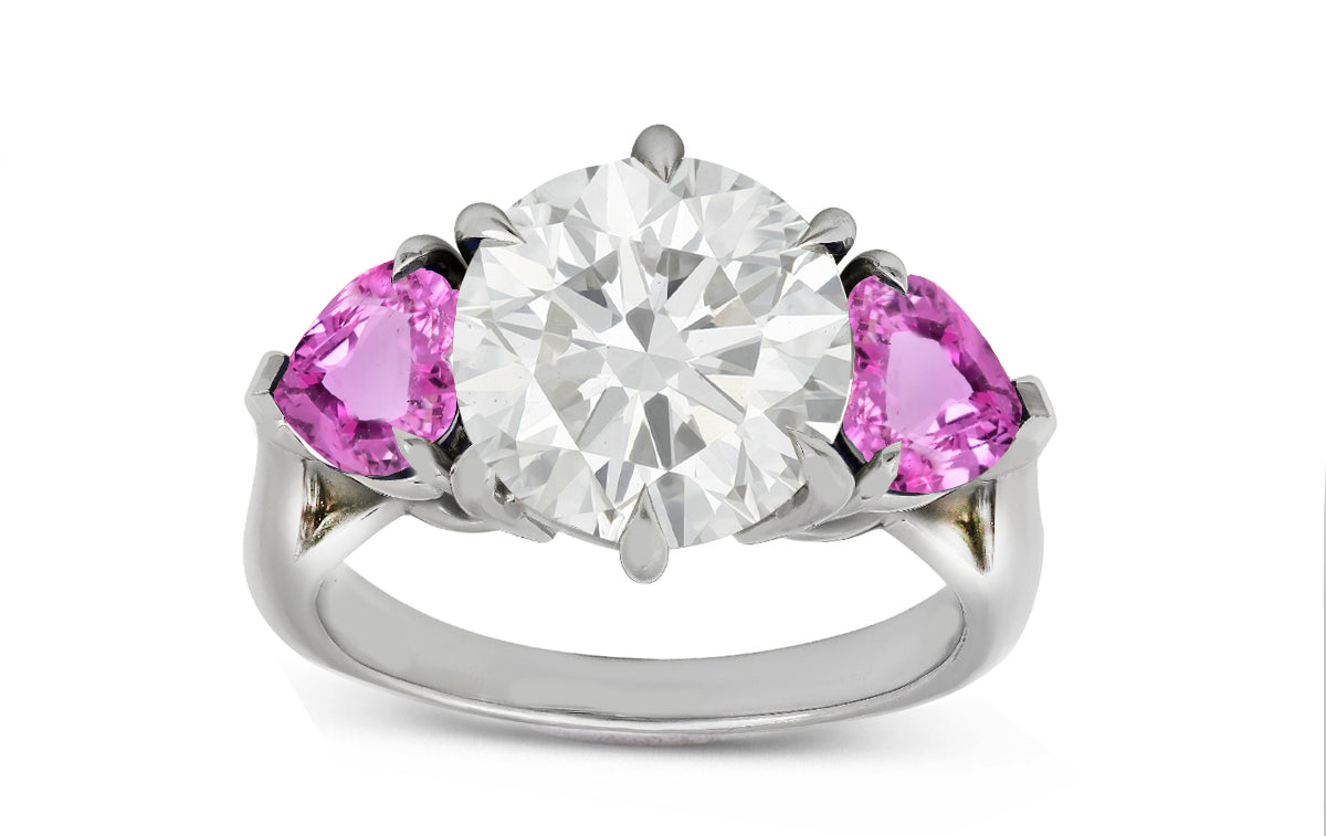 78 custom made unique round diamond and heart pink sapphire side three stone engagement ring