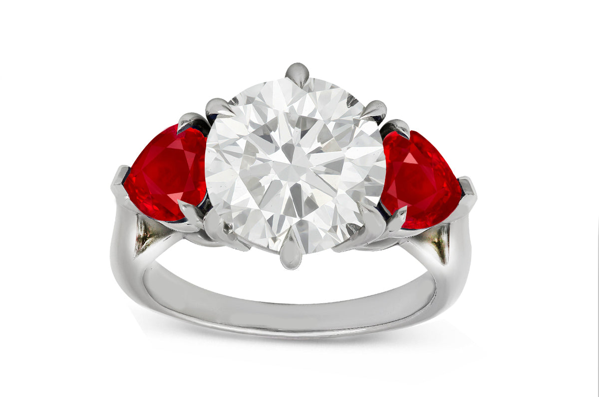 78 custom made unique round diamond and heart ruby side three stone engagement ring