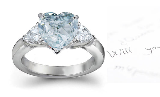 engagement ring three stone with fancy heart blue diamond center and pear diamond sides