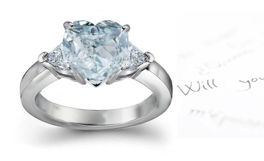 engagement ring three stone with fancy heart blue diamond center and trillion diamond sides