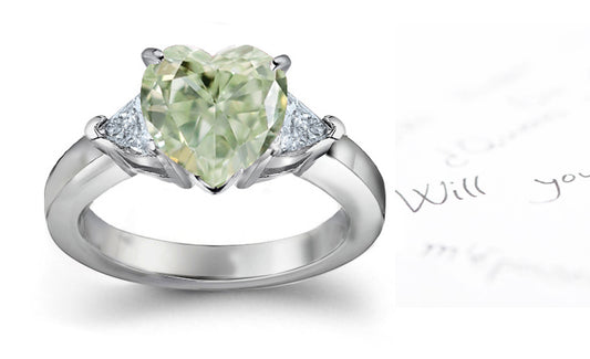 engagement ring three stone with fancy heart green diamond center and trillion diamond sides