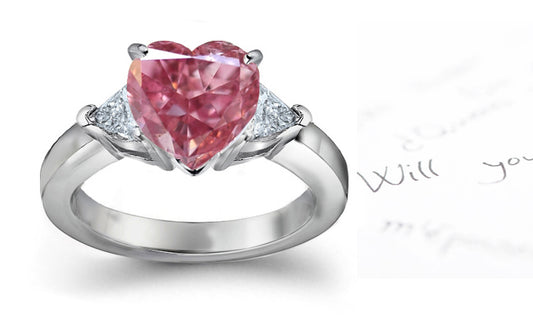 engagement ring three stone with fancy pink diamond center and trillion diamond sides