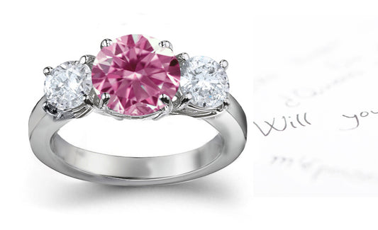 engagement ring three stone with round pink diamond and side round white diamonds