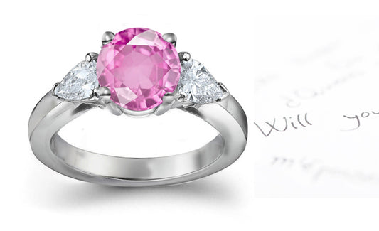 engagement ring three stone with round pink sapphire and side pear diamonds
