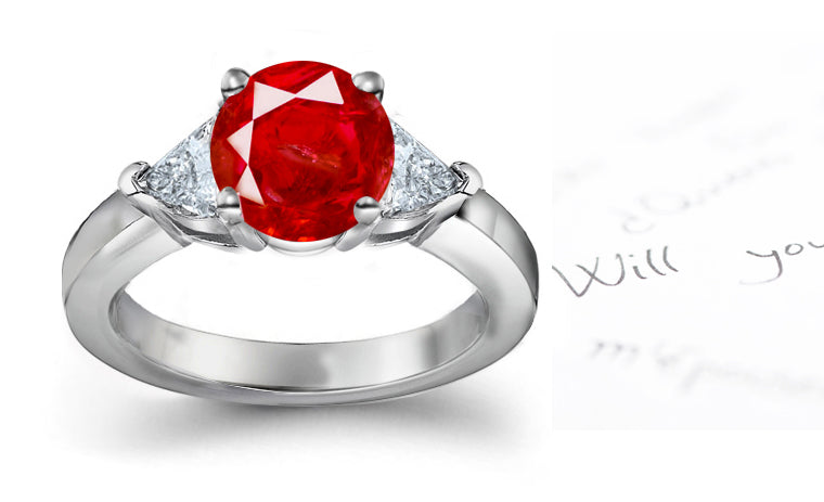 engagement ring with round ruby center side heart diamonds