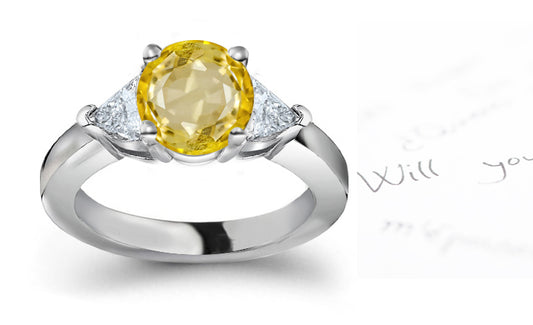 engagement ring three stone with round yellow sapphire center and side trillion diamonds