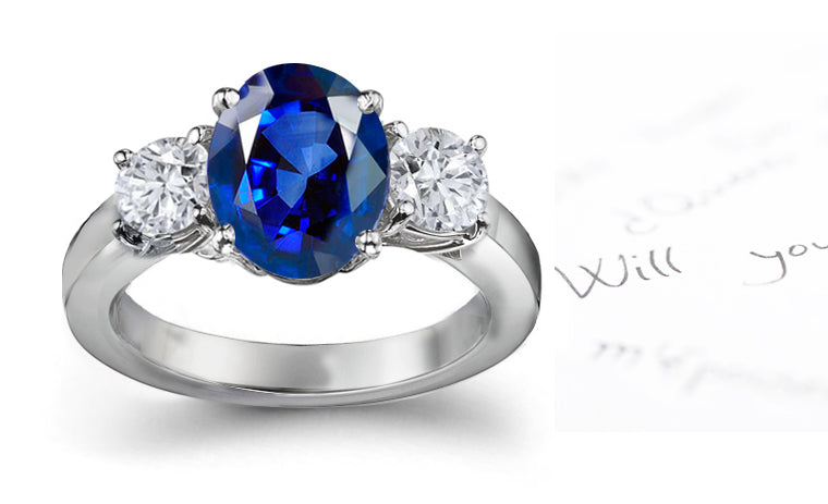 engagement ring three stone with oval blue sapphire and side oval diamonds