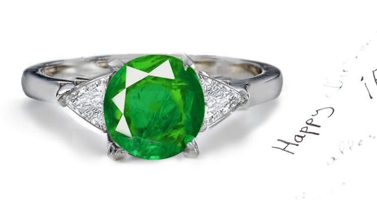 engagement ring three stone with round emerald center and side trillion diamonds