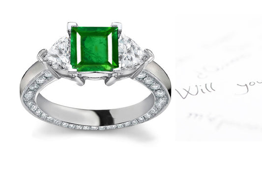 engagement ring with square emerald center and diamond accents band