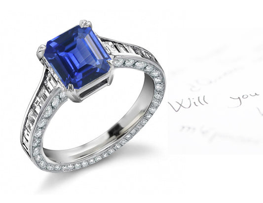 engagement ring with emerald cut blue sapphire center and diamond accents band