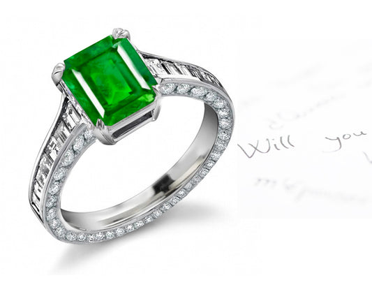 engagement ring with emerald cut emerald center and diamond accents band