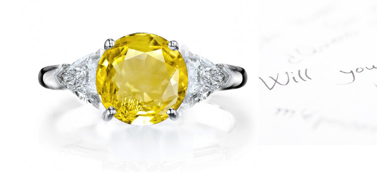 engagement ring three stone with round yellow sapphire center and side trillion diamonds