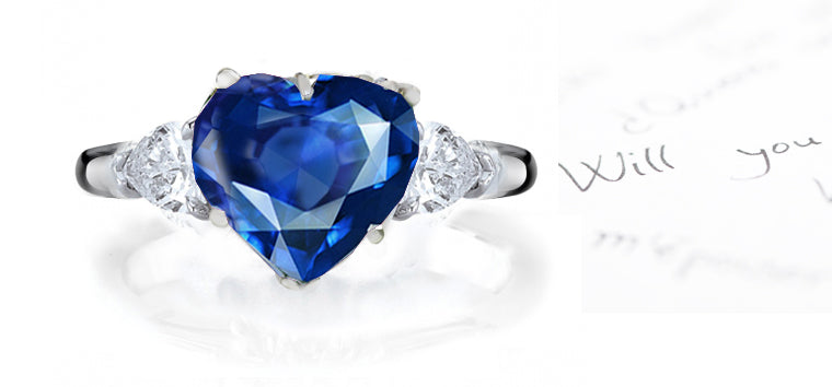 engagement ring three stone with heart blue sapphire center and side pear diamonds