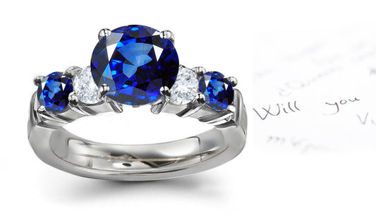 engagement ring handcrafted with alternating round blue sapphires and diamonds