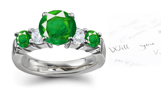 engagement ring with five round emeralds and diamonds