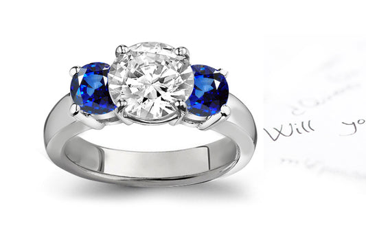 engagement ring three stone with round diamond and side round blue sapphires