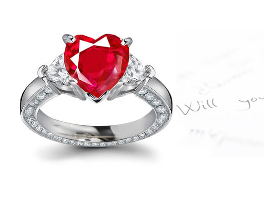 three stone engagement ring with heart ruby and diamonds