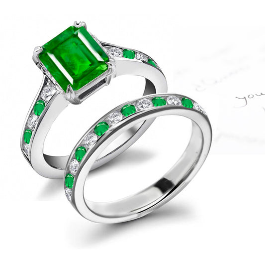 bridal set handcrafted with emerald cut emerald center and band with alternating round emeralds and diamonds