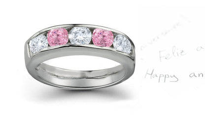 Anniversary ring alternating with 5 round pink and white diamonds