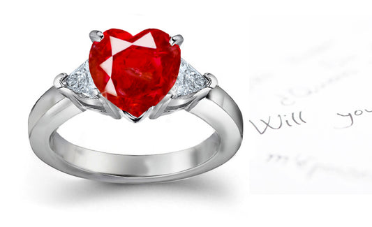 engagement ring three stone with heart ruby center and side trillion diamonds