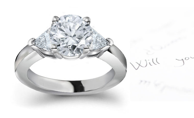 engagement ring three stone with round diamond center and side trillion diamonds