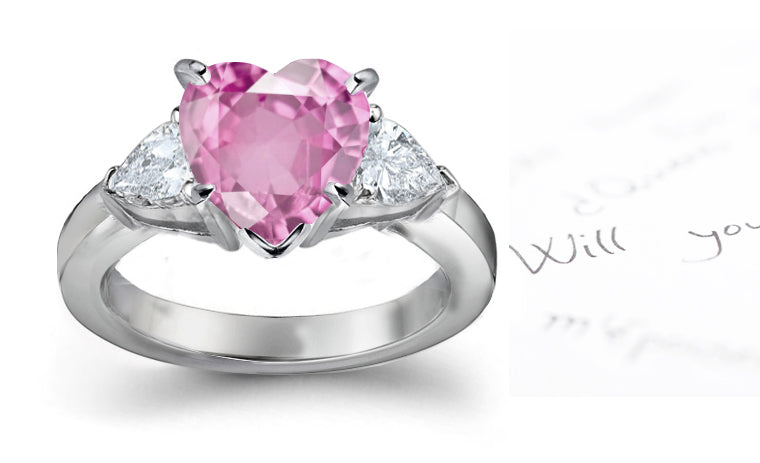engagement ring three stone with heart pink sapphire center and side pear shaped diamonds