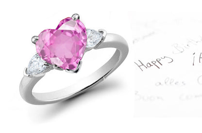 engagement ring three stone with heart pink sapphire center and side pear shaped diamonds