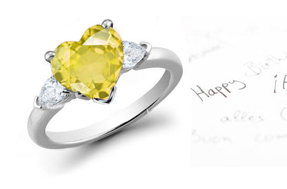 engagement ring three stone with yellow heart diamond center and side pear white diamonds