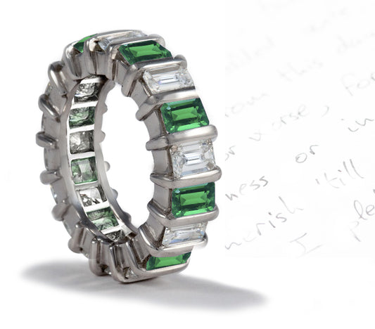 eternity ring handcrafted with bar set emerald cut emeralds and diamonds