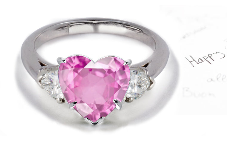 engagement ring three stone with heart pink sapphire center and side pear shaped diamonds