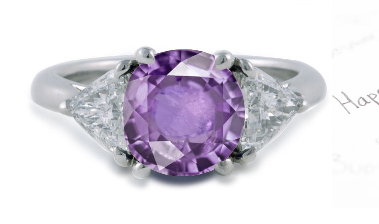 engagement ring with round purple sapphire center and side trillion diamonds