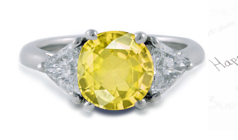 engagement ring three stone with round yellow sapphire center and side trillion diamonds