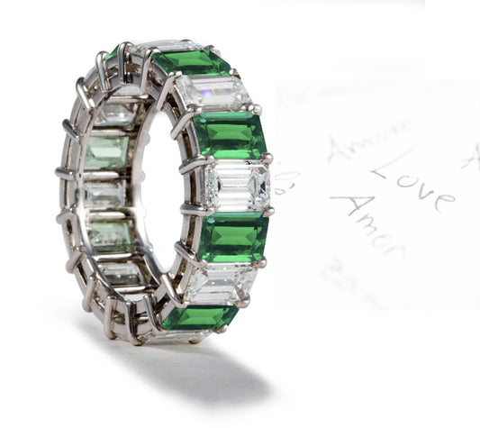 eternity ring prong set with emerald cut emeralds and diamonds