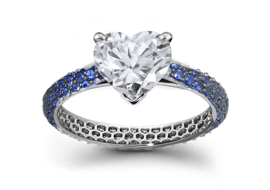 engagement ring handcrafted with heart diamond center and band with pave set blue sapphiress