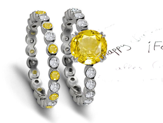 engagement ring with round yellow sapphire center and wedding band with round yellow sapphires and diamonds