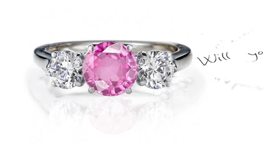 engagement ring three stone with round pink sapphire and round diamond accents