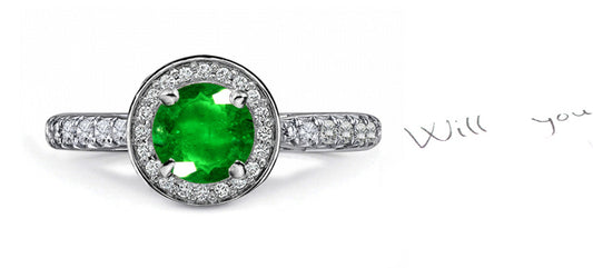 engagement ring with round emerald and diamond halo and band