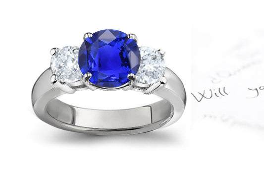 engagement ring three stone with round blue sapphire and side round diamonds