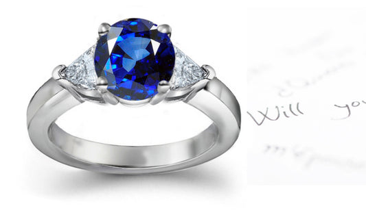 engagement ring three stone with round blue sapphire and side trillion diamonds