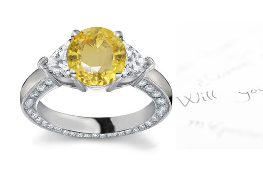 engagement ring handcrafted with round yellow sapphire center and side heart diamonds
