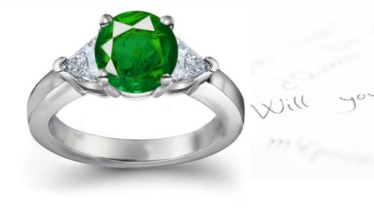 engagement ring with round emerald and side trillion diamonds