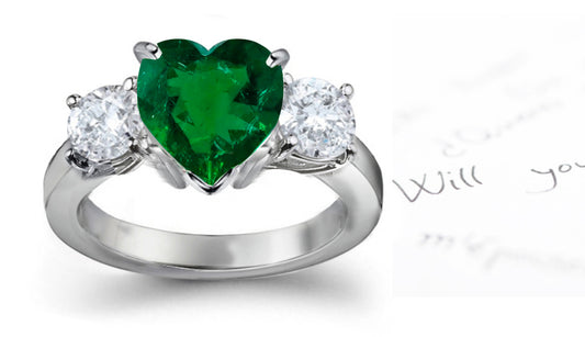 engagement ring heart emerald and side round diamonds
