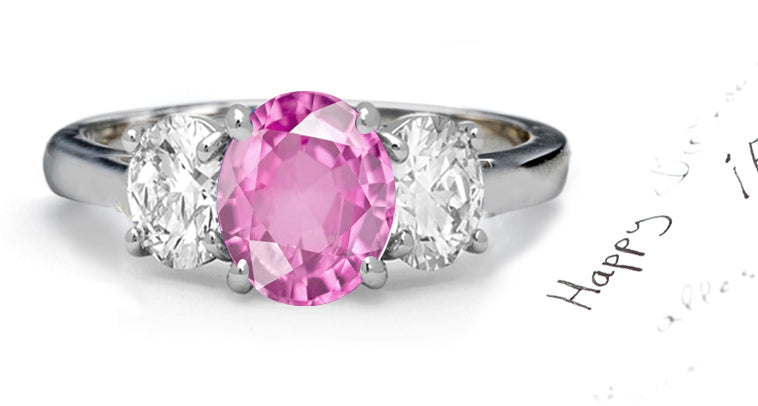 engagement ring three stone with oval pink sapphire and side oval diamonds