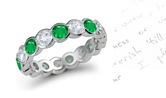 eternity rings with bezel set round diamonds and emeralds