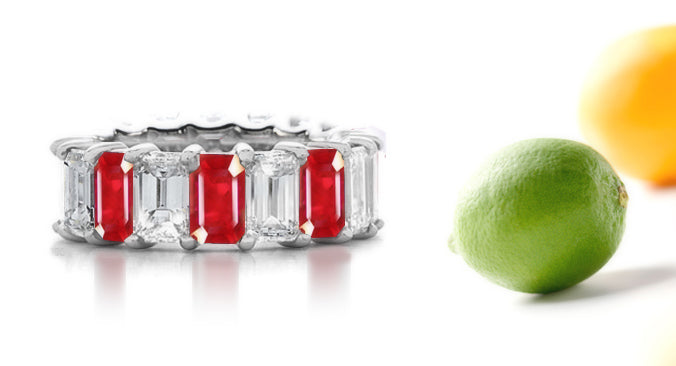 eternity ring prong set with emerald cut rubies and diamonds